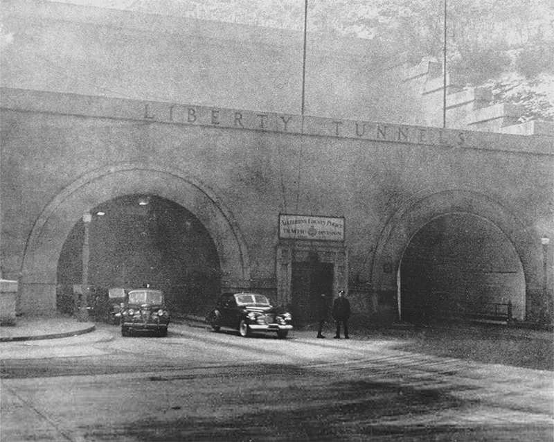 View of Liberty Tunnels' North end, heavy smoke, and traffic scene.