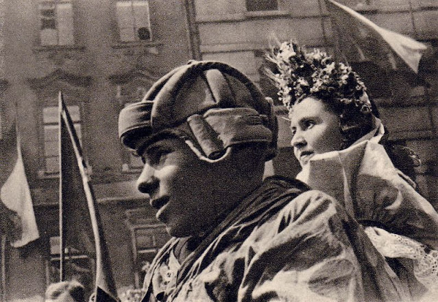 Soldiers atop a tank in Prague, 1945.