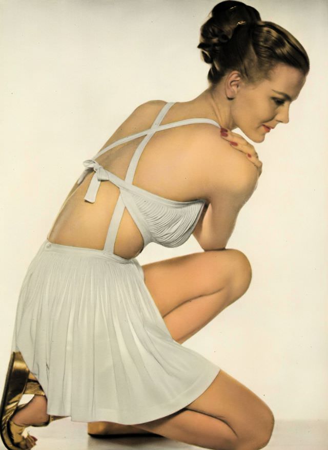 Selene Mahri in a Greek-goddess rayon jersey bathing suit by Tina Leser, Vogue, 1945.