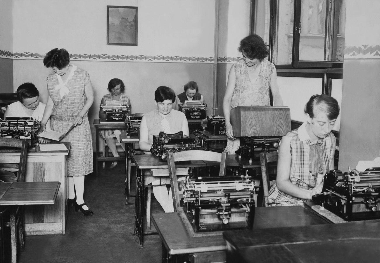 Unemployed women learning typewriting in Berlin, 1930s.