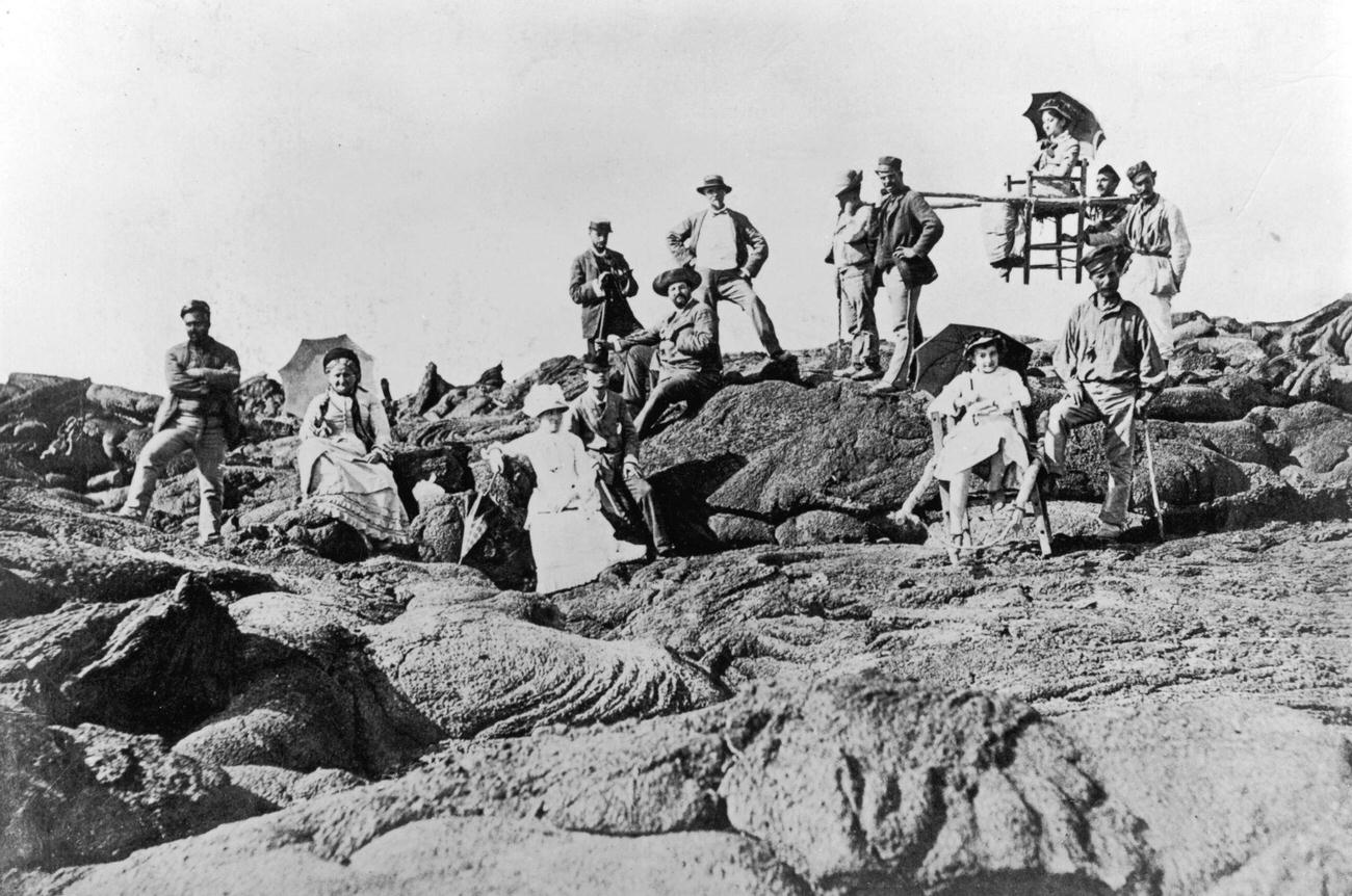 Victorian tourists ascending Mount Vesuvius with local porters.