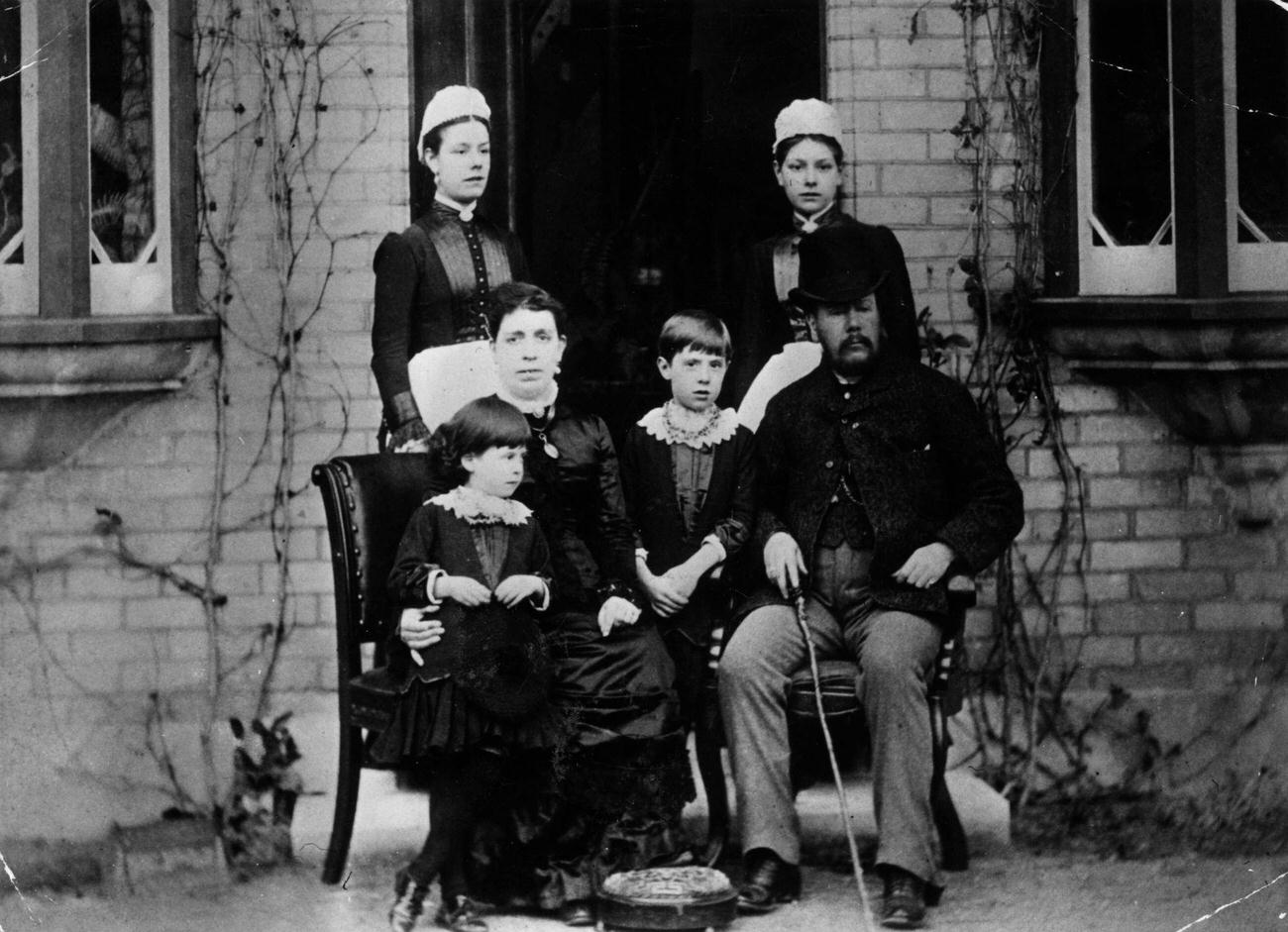 A Victorian family with their two maids, 1875.