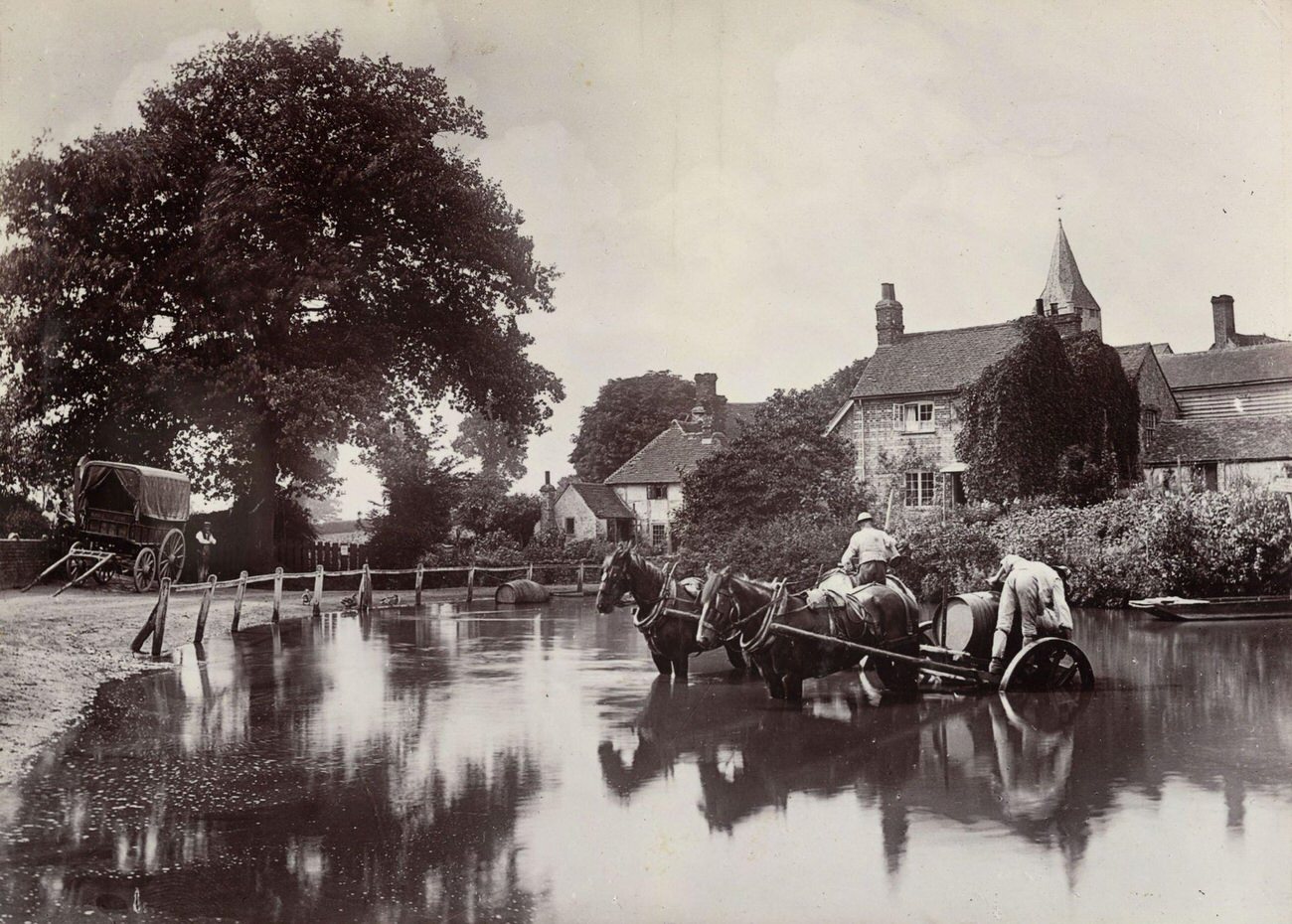 Filling water wagons in an English village, 1890.