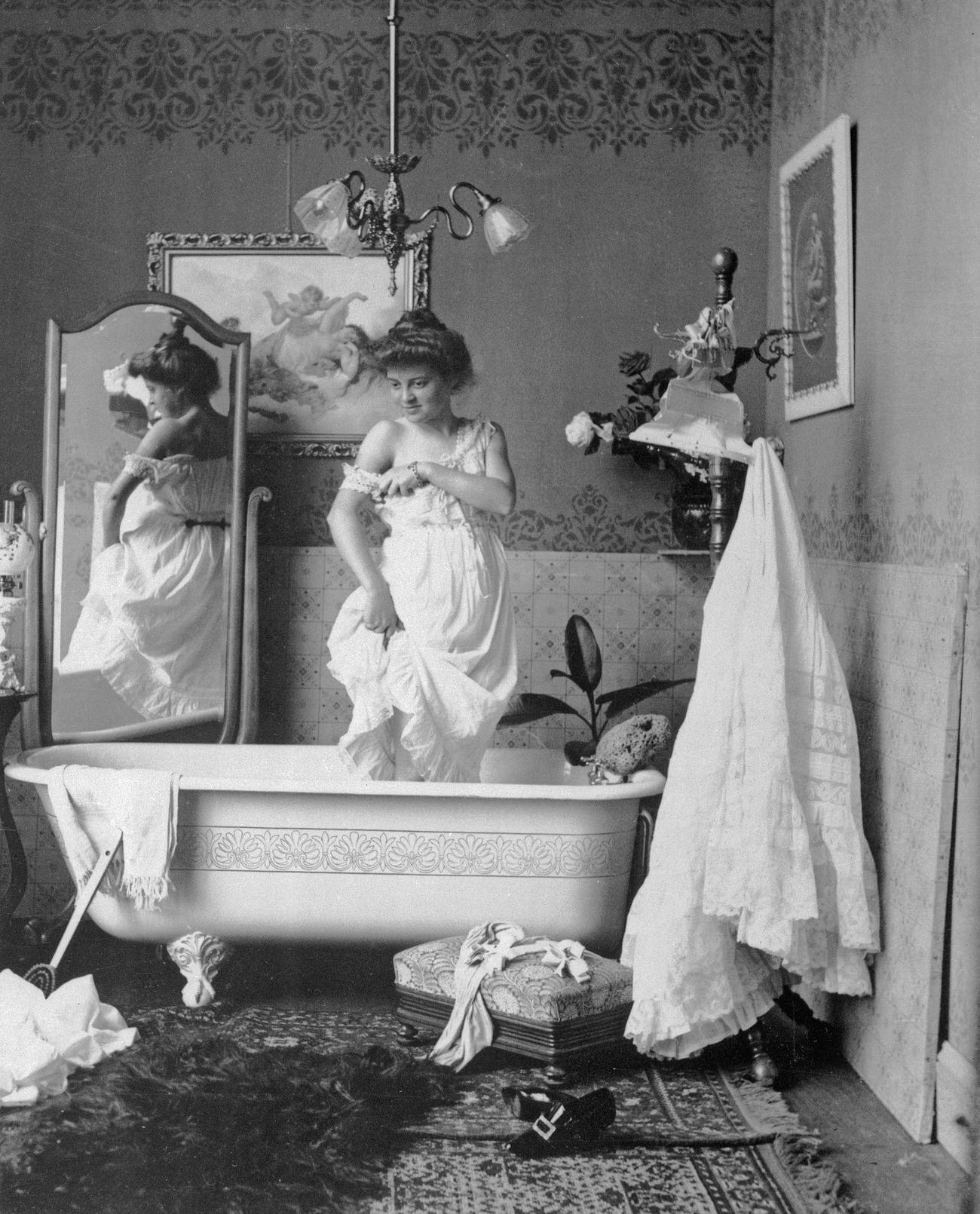 Victorian woman about to bathe, late 19th century.