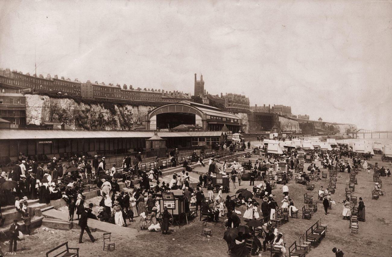 Victorian daytrippers on Ramsgate beach in Kent, circa 1880.