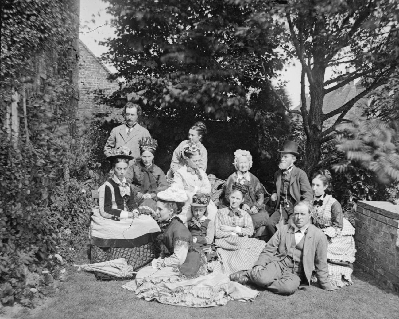 A multi-generational Victorian family in their garden, circa 1895.