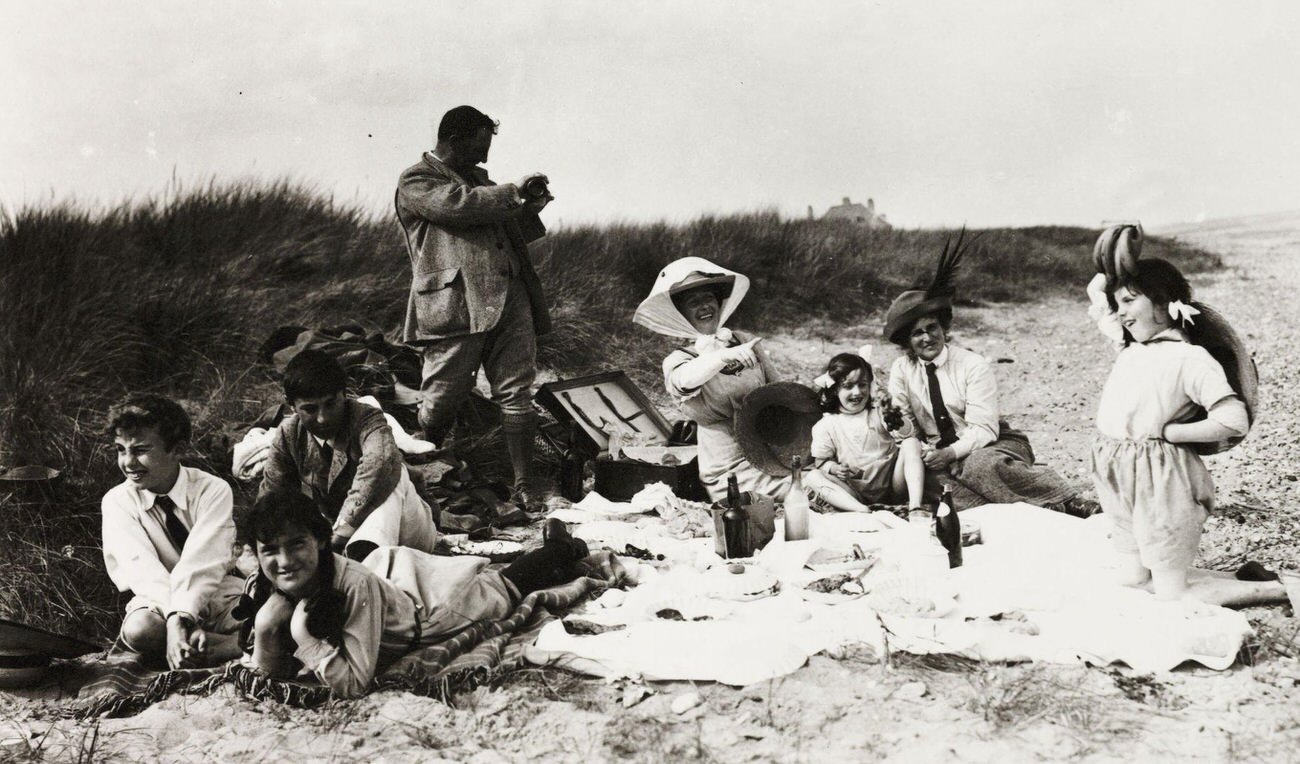 Family picnic on the beach, circa 1895.