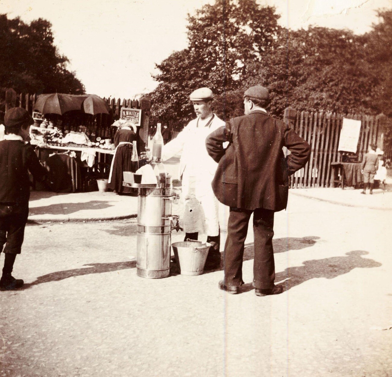 Demonstration at a 'R Whites Ginger beer' stall, circa 1898.