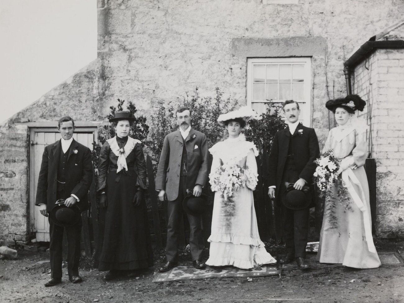 Wedding party snapshot, circa 1900.