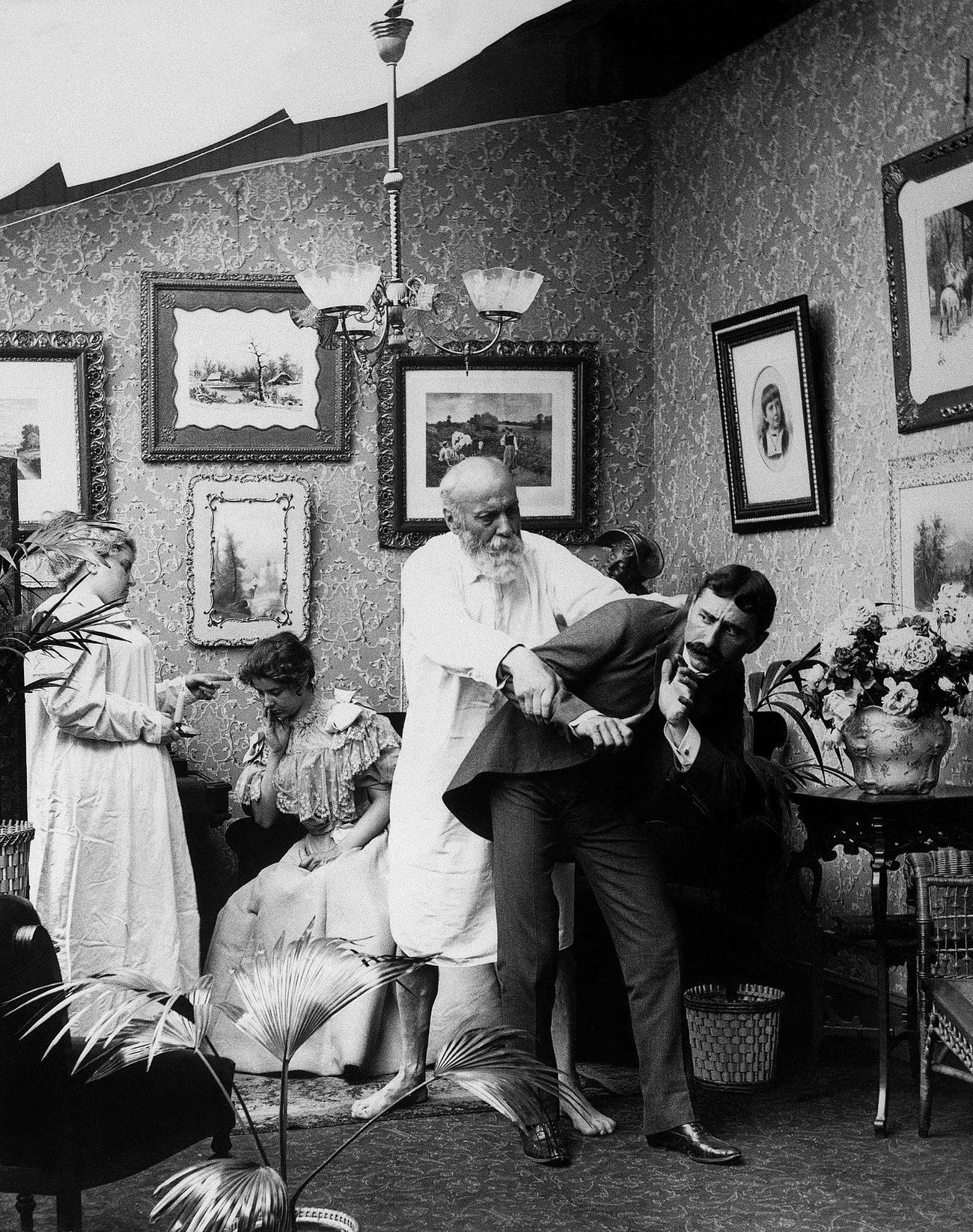 Victorian lovers caught stealing a kiss, circa 1890s.