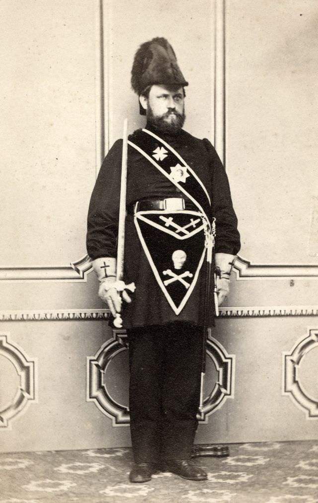 A man is dressed in the regalia of the Knights Templar, a masonic organization that thrived in 19th century America