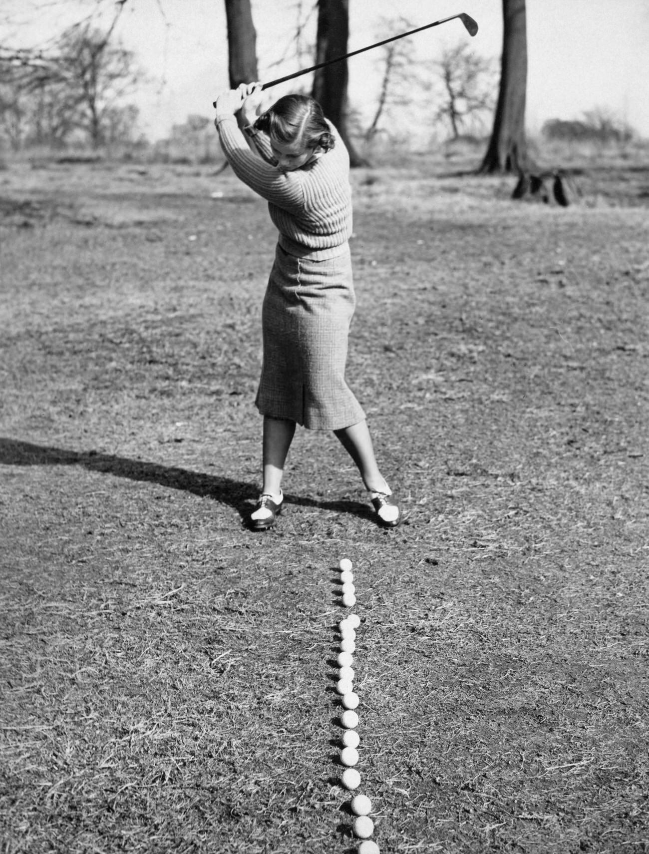 Pamela Barton hitting 21 golf balls, Ashridge Golf Club, March 4, 1938.