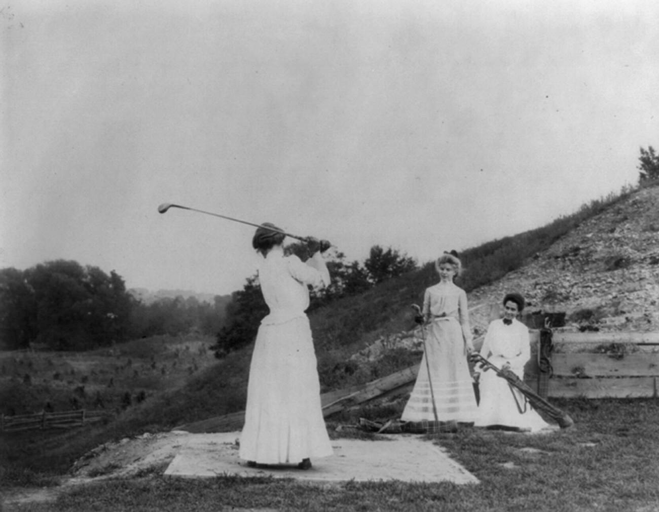 Three American women playing golf, 1900.