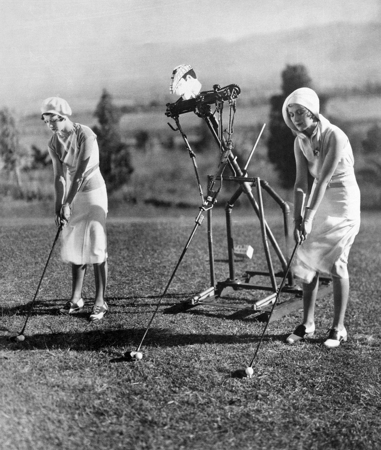 Young women golfing with robot, flapper styles.