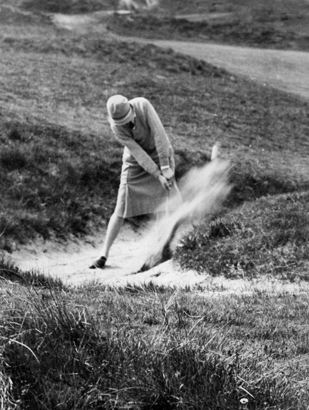 P. Garon playing bunker shots, National golf women festival, Newcastle, 1927.