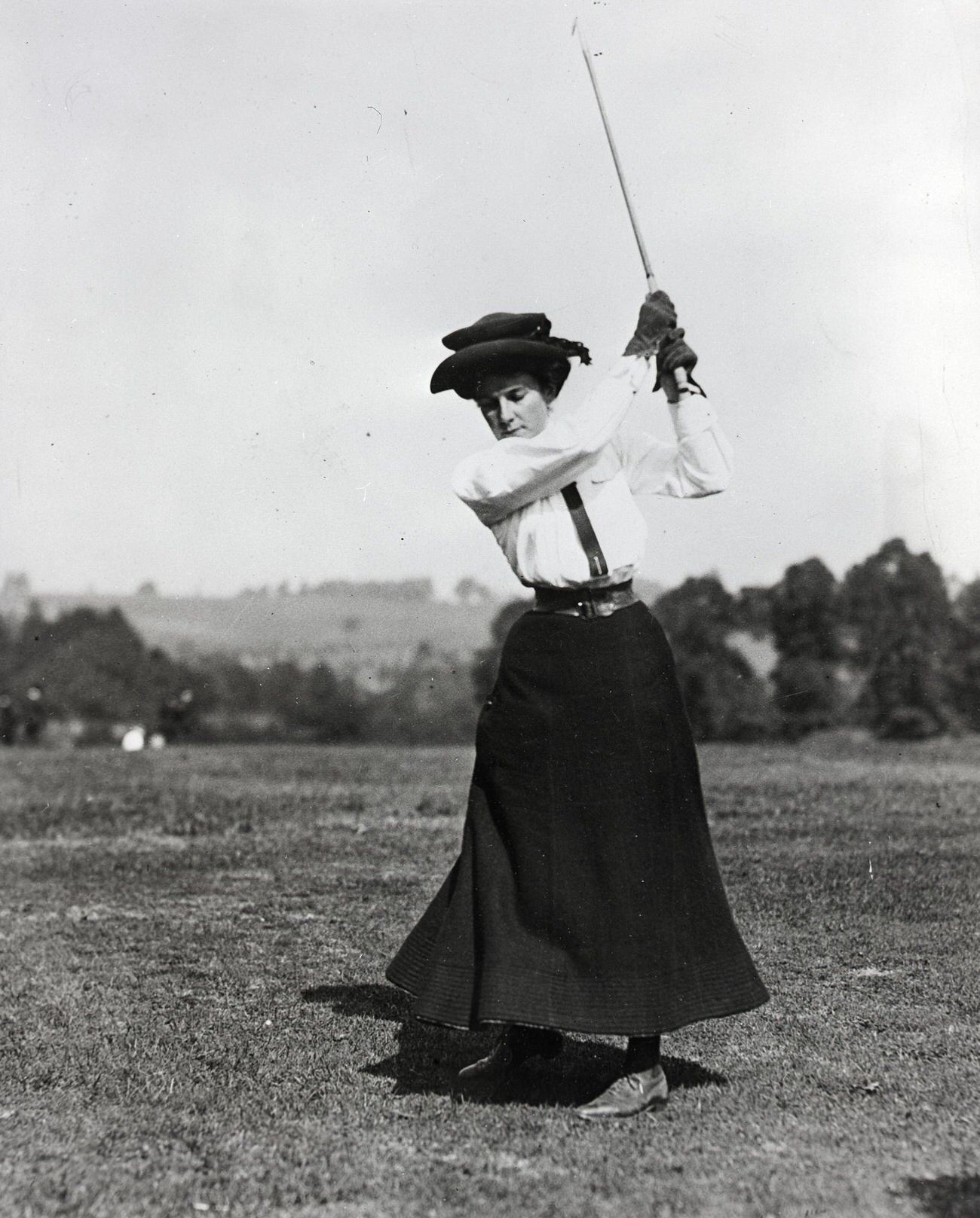 Dorothy Campbell swinging golf club, undated photo.