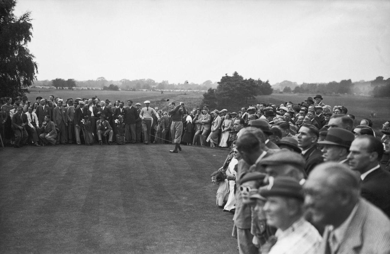 Henry Cotton driving from 3rd green, Walton Heath, Surrey, July 13, 1937.