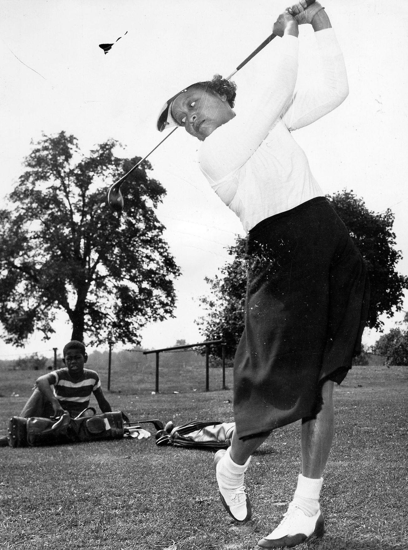 Female golfer in plus fours, Washington DC, 1938.