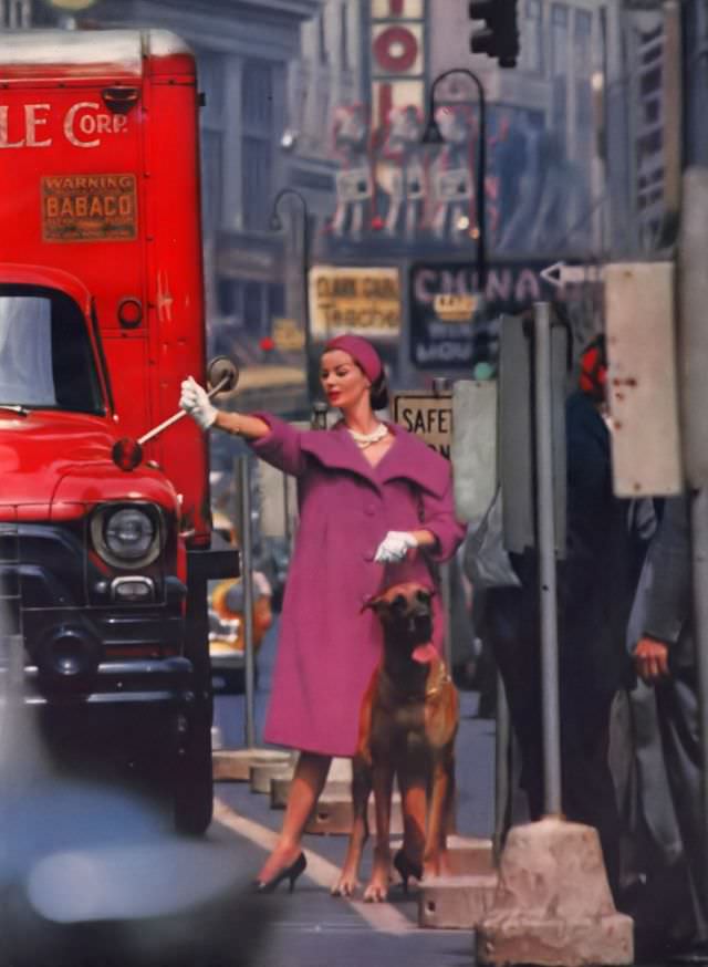 Dolores Hawkins in a fluffed cyclamen wool tweed coat by Tiffeau-Busch, Vogue, July 1958.