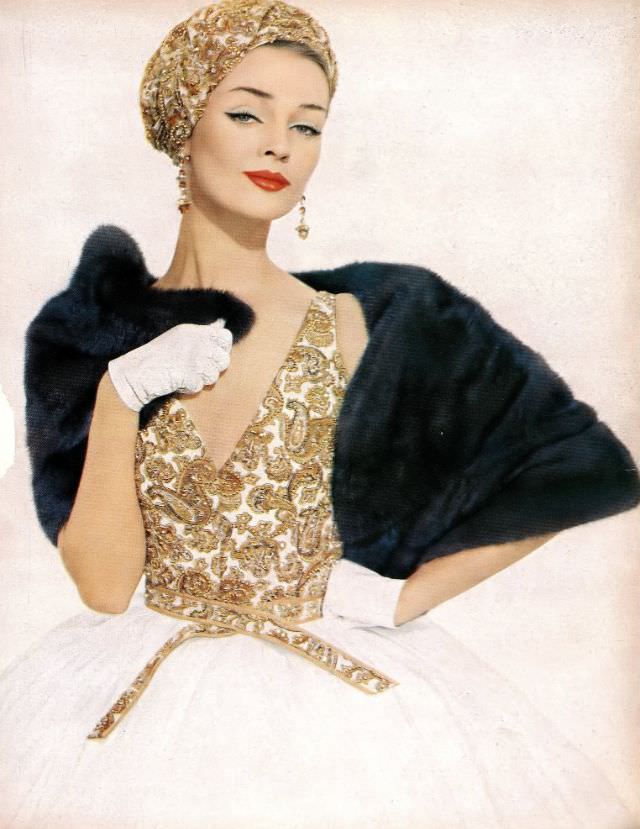 Dolores Hawkins in a hand-embroidered golden paisley challis bodice and white organdy skirt with matching turban by James Galanos, Harper's Bazaar, March 1958.