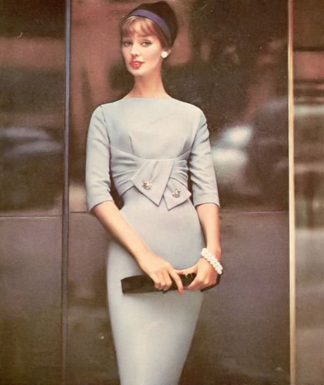 Dolores Hawkins wearing an empire draped wool dress by R & K Originals, 1958.