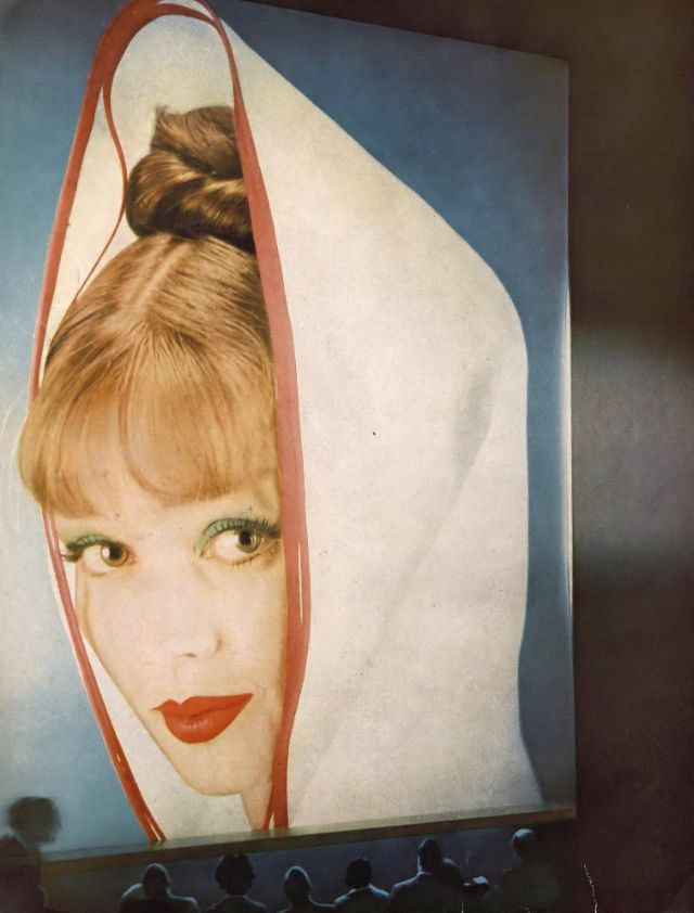 Dolores Hawkins wearing "Snow Ball of Fire" lipstick and Emerald Green eyeshadow stick by Du Barry, Harper's Bazaar, June 1959.