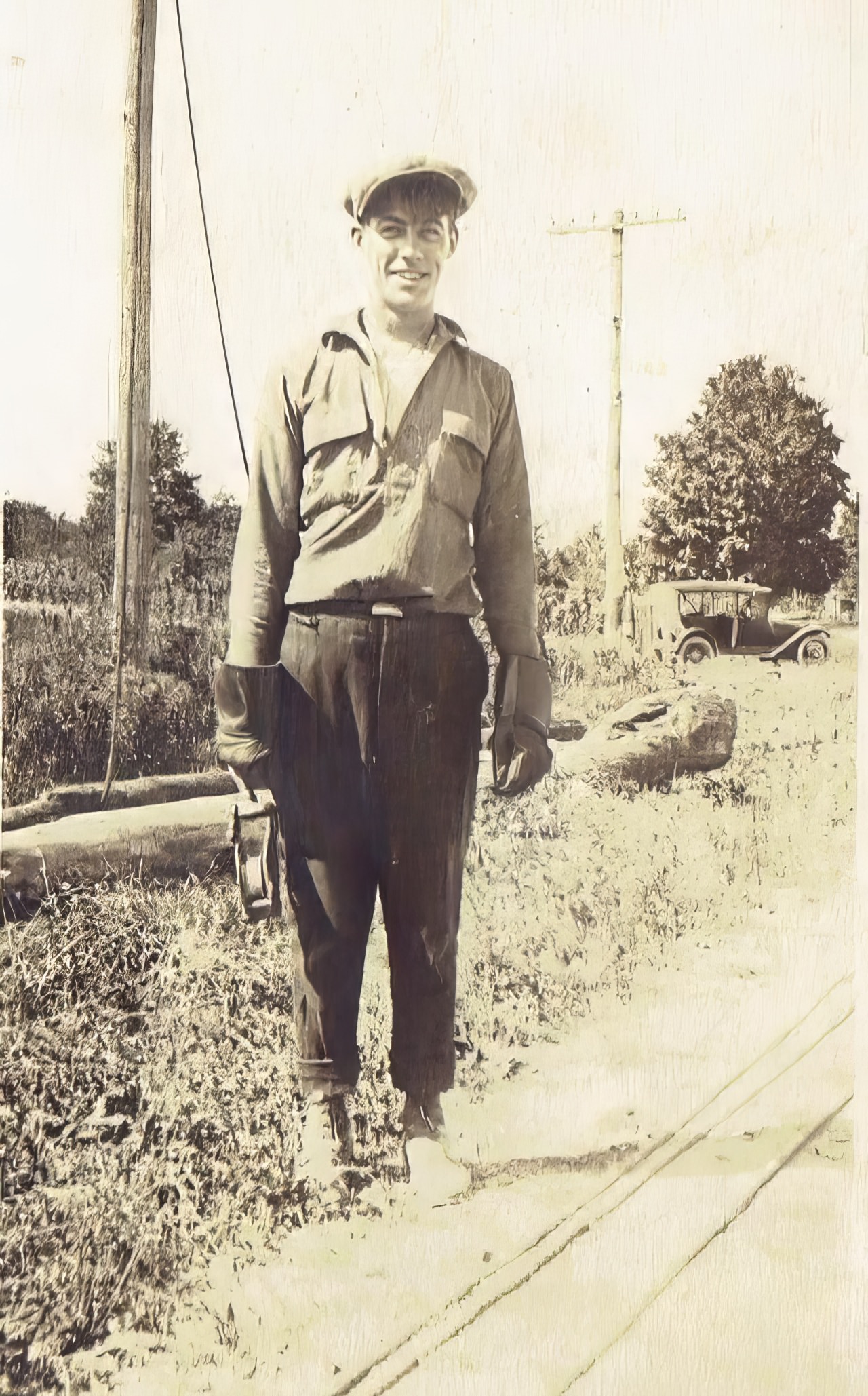 John M. Bassette holding a pulley, Auburn, circa 1916