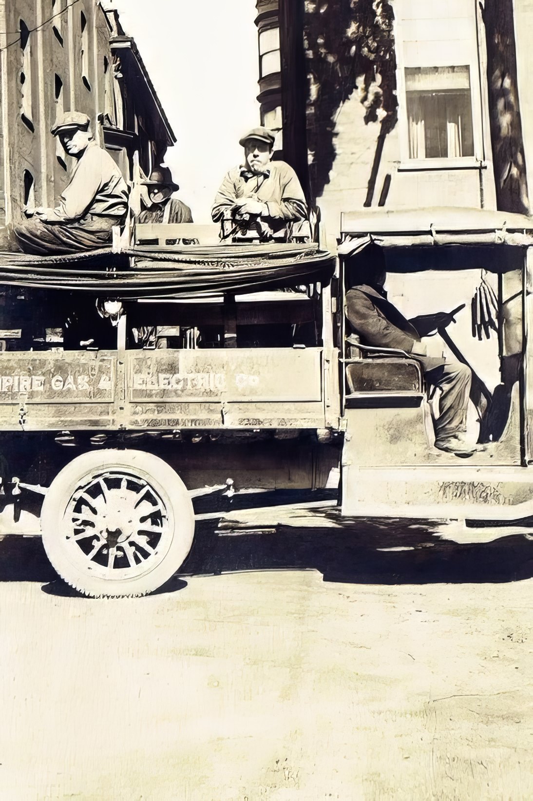 Thomas Welch, A. Fields, and C. McCoy on a company truck, Geneva, 1918