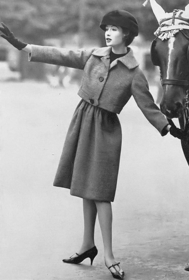 Gitta Schilling in tweed skirt and jacket by Guy Laroche, October 1958.