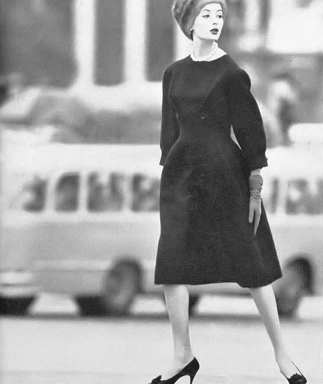 Gitta Schilling in black tweed dress by Pierre Balmain, October 1958.