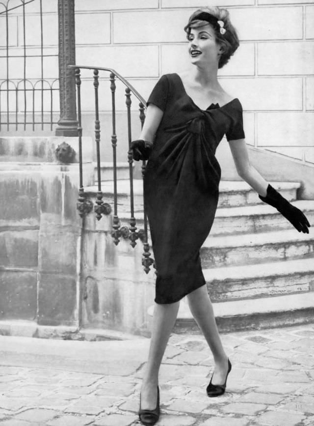 Gitta Schilling in black crêpe dress by Guy Laroche, October 1, 1958.