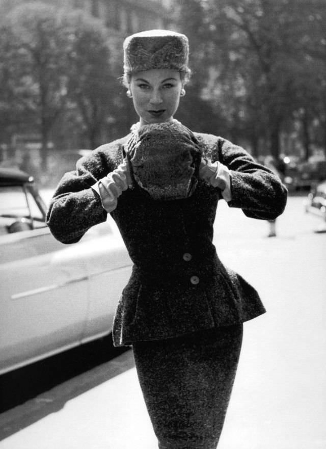 Stella in a peplum jacket and skirt by Jacques Fath, Paris, 1953.