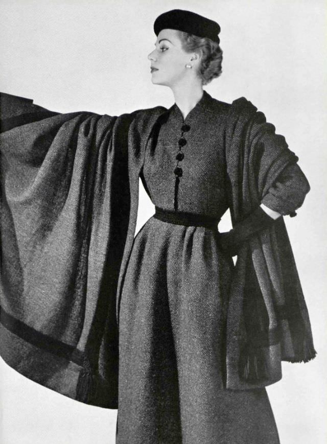 Stella in a tweed day-dress with shawl by Madeleine de Rauch, 1953.