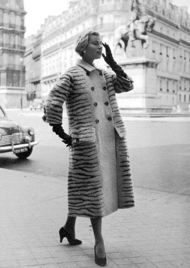 Stella in a tiger-stripe wool coat by Jacques Fath, Paris, 1953.