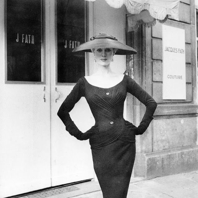 Stella in a black wool jersey afternoon dress by Jacques Fath, Autumn 1954.