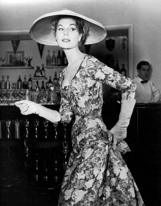 Stella in a printed silk dress by Jacques Fath, 1955.
