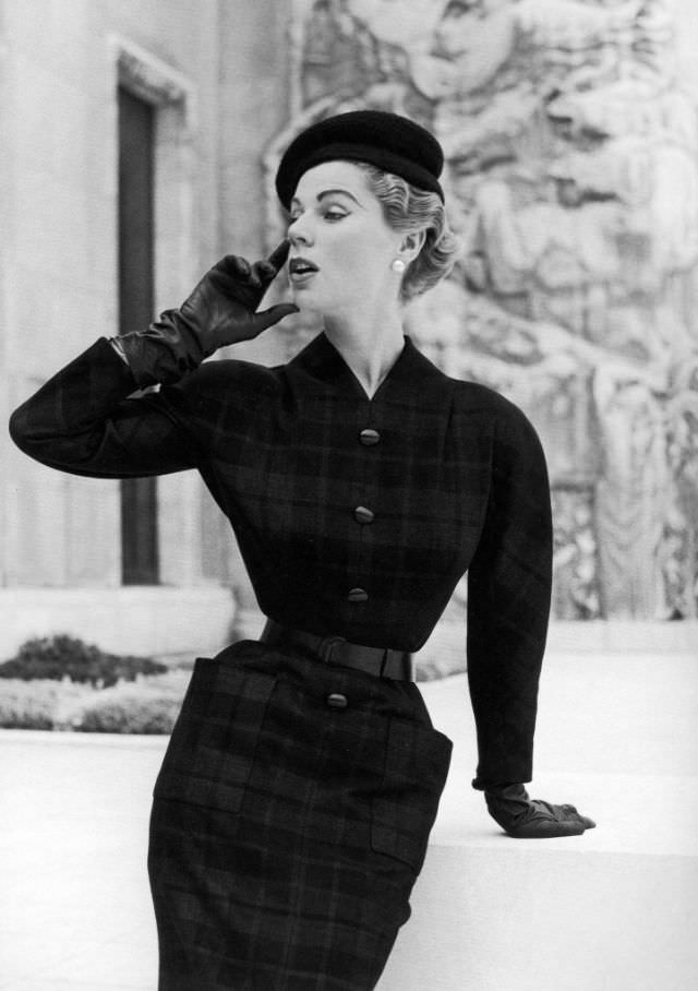 Stella in a wool plaid afternoon dress by Madeleine de Rauch, 1953.