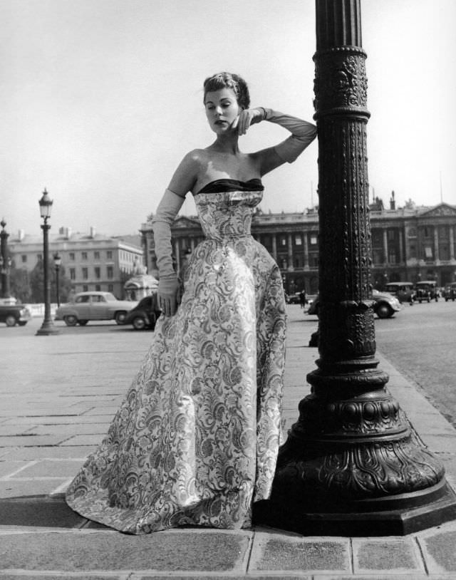 Stella in a satin strapless evening gown by Jacques Fath, Paris, 1953.