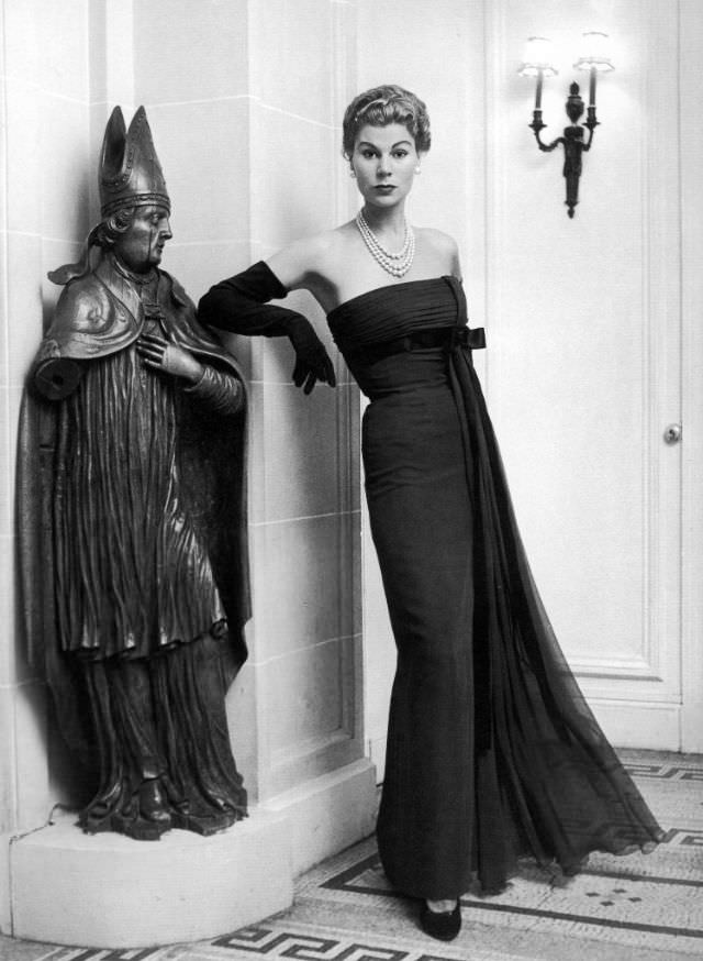 Stella in a chestnut mousseline empire-style evening gown by Jacques Fath, 1953.