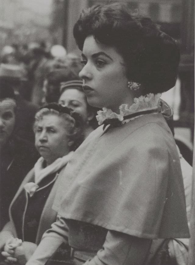 Woman with shoulder covering and lace collar, 1957