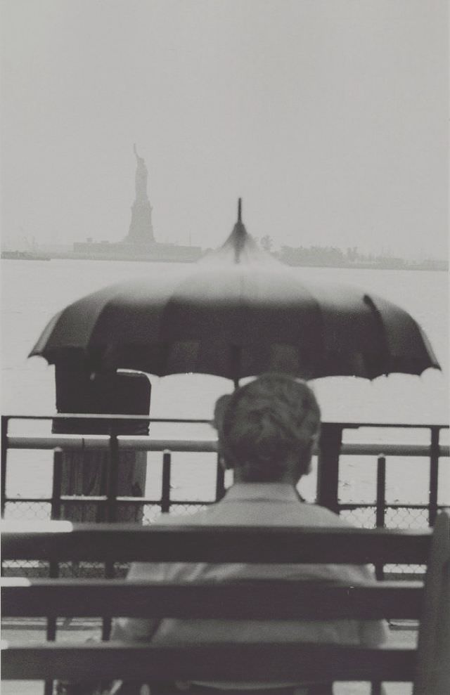 Man looking towards the Statue of Liberty, August 1954