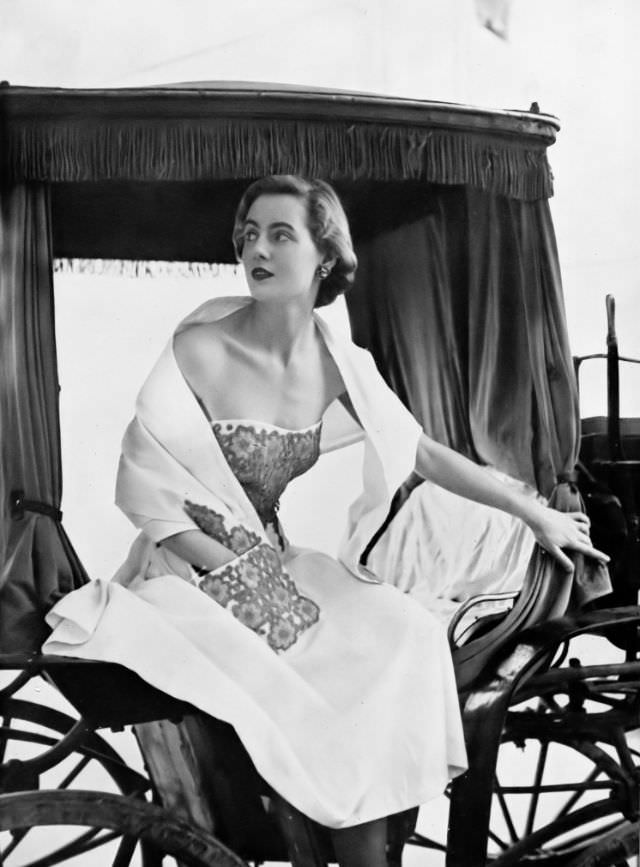 Pat O'Reilly in a white piqué strapless dress by Harvey Nichols, Malta, Harper's Bazaar UK, May 1951.