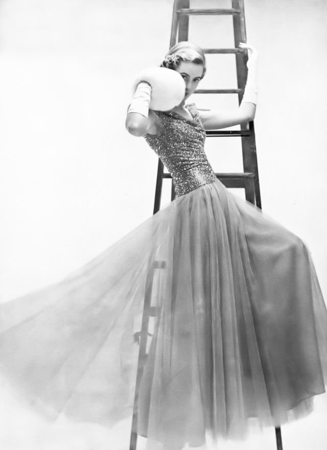 Pat O'Reilly in a lavender tulle evening dress by Elizabeth Henry, Harper's Bazaar UK, February 1951.