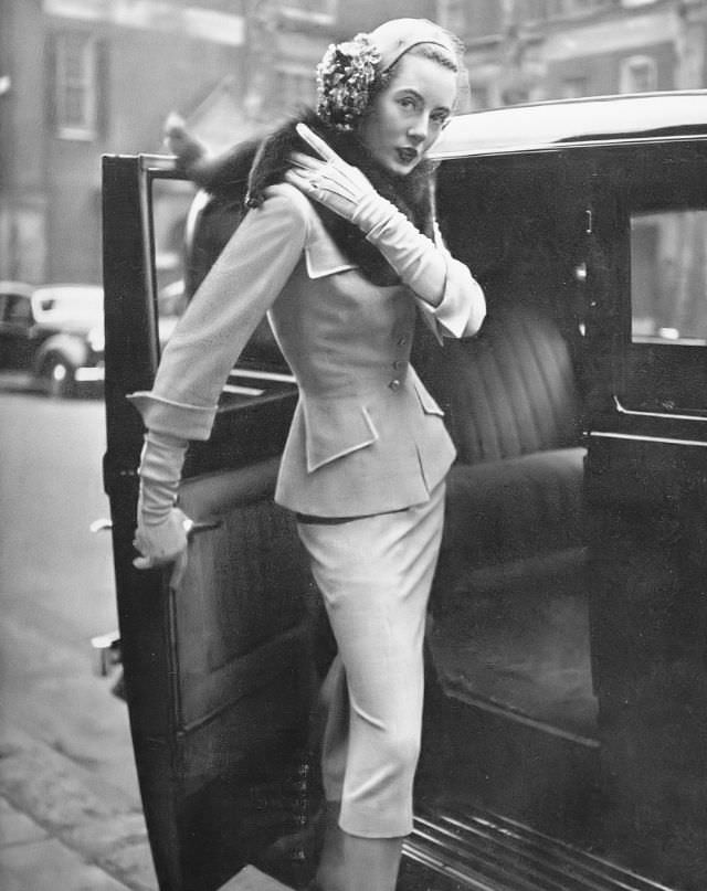 Pat O'Reilly in her going-away suit in mushroom pink by Frederick Starke, Harper's Bazaar UK, March 1950.