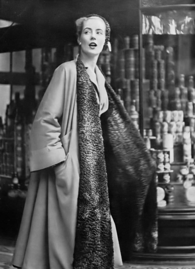 Pat O'Reilly in a reversible coat by Bradleys, Harper's Bazaar UK, November 1951.