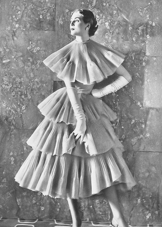 Pat O'Reilly in a lilac lace pagoda-dance dress by Michael Sherard, Harper's Bazaar UK, March 1952.