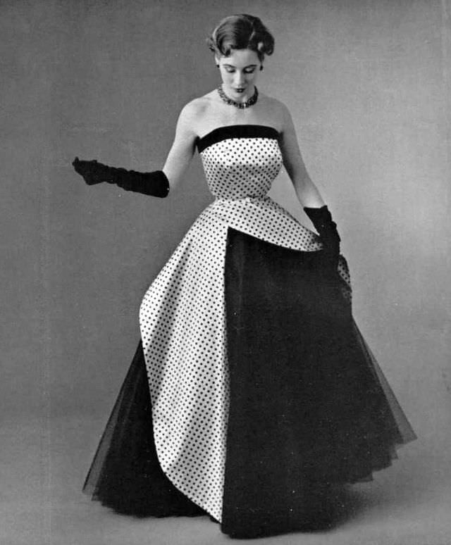 Pat O'Reilly in a white satin and navy tulle dress by Jean Patou, 1952.