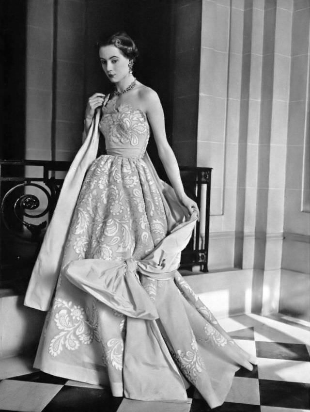 Pat O'Reilly in a lace evening gown by Germaine Lecomte, 1952.