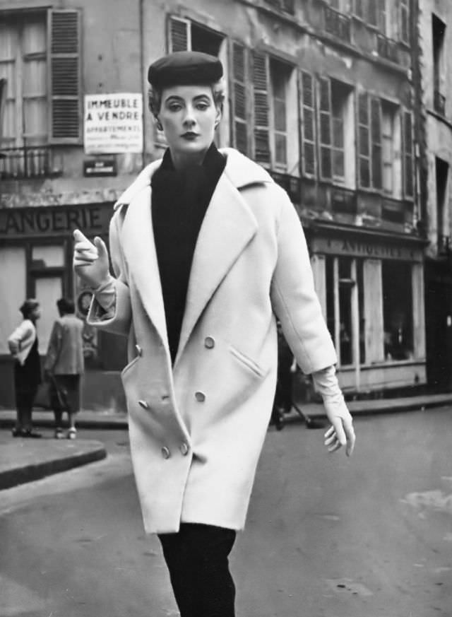 Pat O'Reilly in a white coat by Balenciaga, Paris, Harper's Bazaar UK, September 1953.