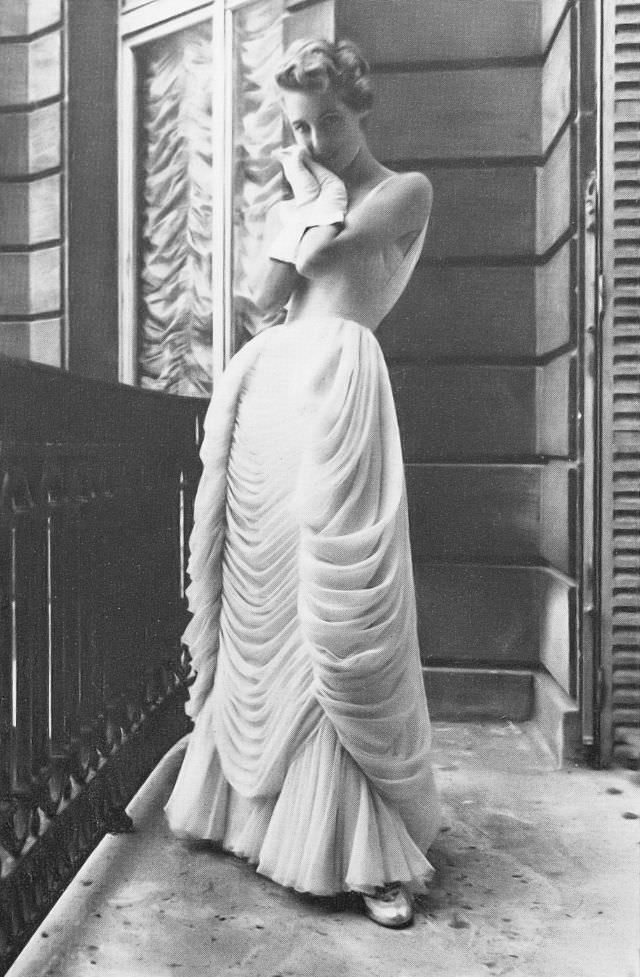 Pat O'Reilly in a pink chiffon gown by Jean Dessès, Harper's Bazaar UK, October 1953.